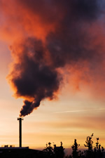 Smoke pouring out of a smokestack