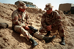 Marine corps journalist interviews a gunnery sergeant during Operation Desert Storm.