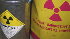 Two containers marked with radioactive materials warnings