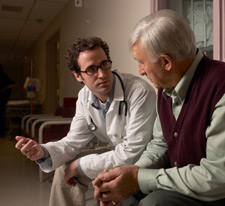 Doctor talking with male patient