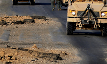 Pits left from roadside bomb Pits left from roadside bomb