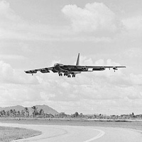 Plane flying above runway at U-Tapao Air Base