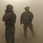 Dust surrounding a group of   paratroopers