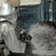 Man spraying foam from a hose.