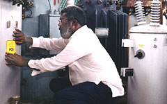 Man labeling PCB-containing transformers