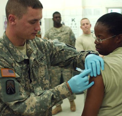Female Servicemember getting vaccinated Female Servicemember getting vaccinated
