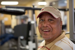 Veteran exericising at a community gym.