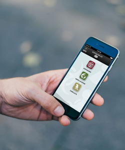 Photo of a hand holding a mobile phone showing the Expsoure Ed app