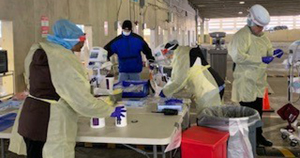 health workers in a lab setting