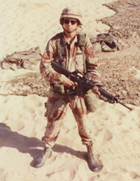Watts in army uniform, in desert