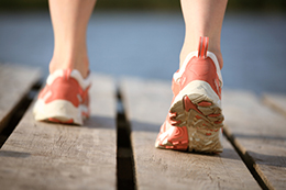 National Public Health Week 2016 Feet in athletic shoes walking on a boardwalk