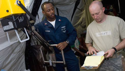 Technicians adjust x-ray equipment Technicians adjusts x-ray equipment