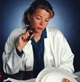 Doctor reading at desk