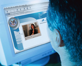 Man taking online course, viewing computer screen