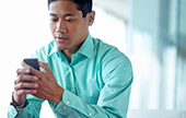 Man reading a text on his smartphone