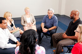 A group of people sitting at a counseling session