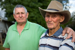 An image of two elderly brothers outdoors