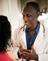 Male doctor talking to a female patient