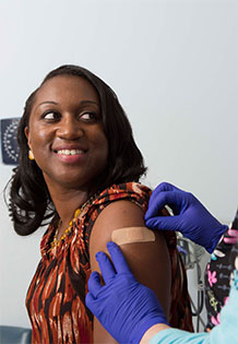 Woman getting immunized Woman getting immunized