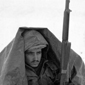 Soldier sitting in snow