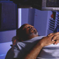 Veteran on imaging scanner bed