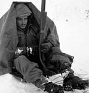 Soldier sitting in the snow under a blanket in the Chosin Reservoir Soldier sitting in the snow under a blanket in the Chosin Reservoir